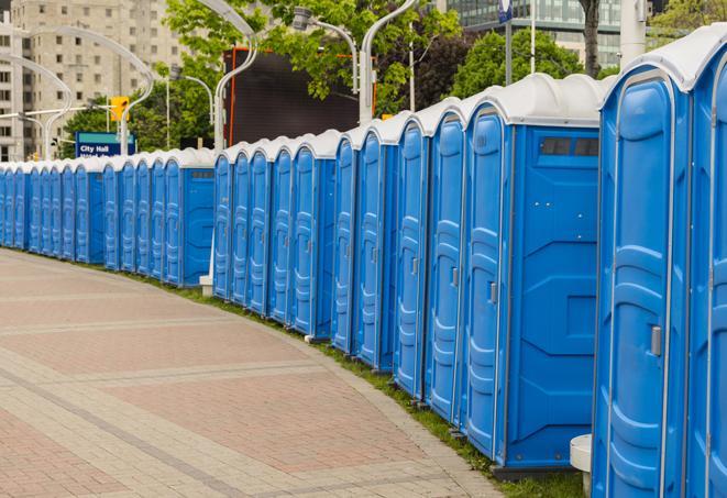 a row of portable restrooms set up for a special event, providing guests with a comfortable and sanitary option in Burlington, KY